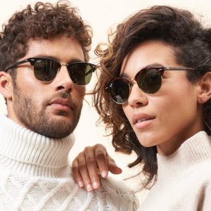 Man and woman standing together wearing Ray-Ban eyeglasses at MintVision Oakville